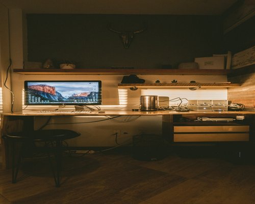 Cozy workspace with warm ambient lighting at night